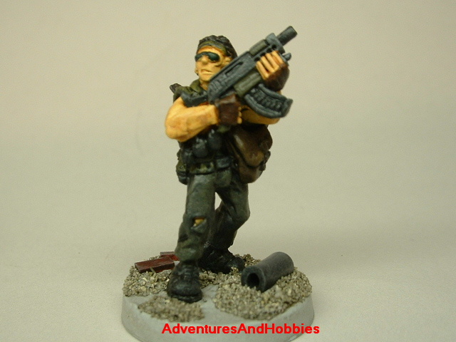 Post apocalypse soldier survivor with SMG 25mm painted figure for role-playing games and table top war games front view