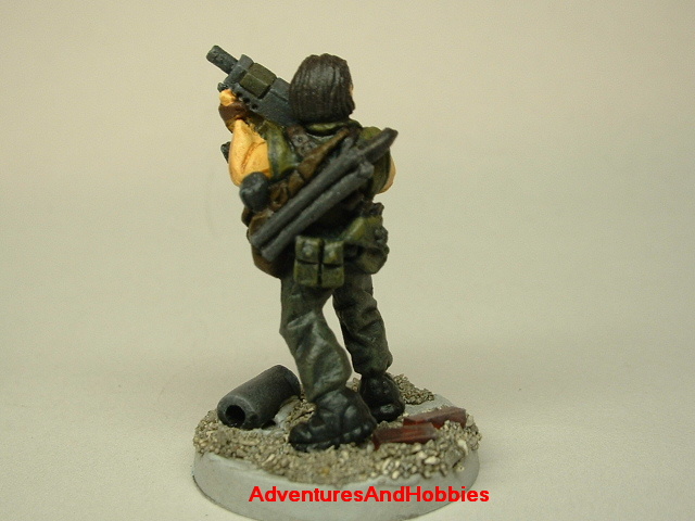 Post apocalypse soldier survivor with SMG 25mm painted figure for role-playing games and table top war games rear view