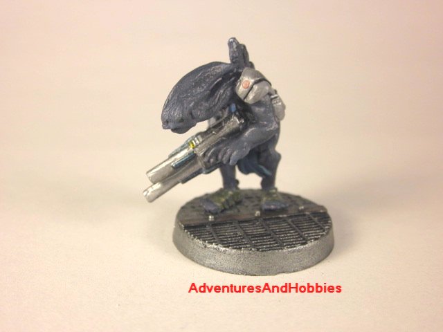 Alien warrior with pulse rifle painted 25 mm figure for science fiction role-playing games and table top war games front view