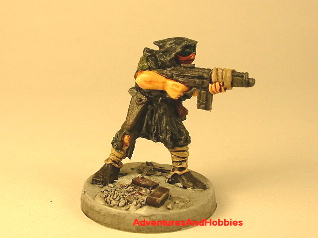 Post apocalypse soldier with assault rifle 25 mm painted figure for role-playing games and table top war games front view