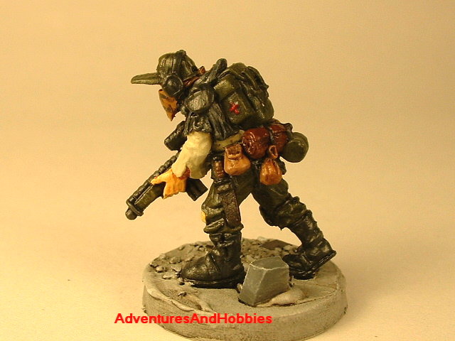 Post apocalypse soldier with sniper rifle 25 mm painted figure for role-playing games and table top war games rear view