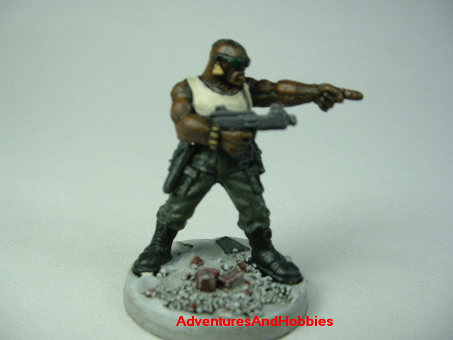 Post apocalypse soldier zombie hunter with submachinegun painted figure for role-playing games and table top war games - front view