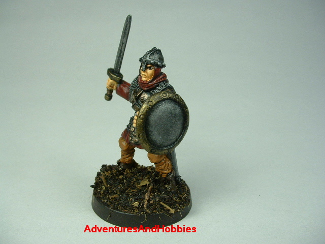 Man at arms with sword painted figure for fantasy role-playing games and table top war games - side view