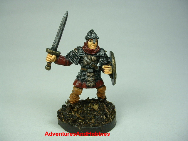 Man at arms with sword painted figure for fantasy role-playing games and table top war games - front view