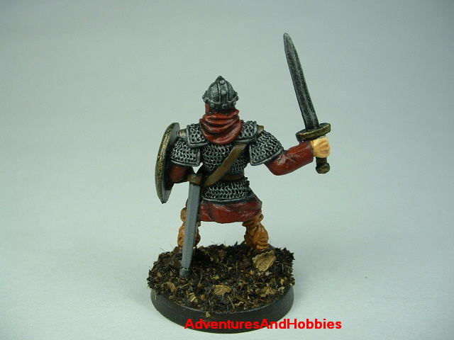 Man at arms with sword painted figure for fantasy role-playing games and table top war games - rear view