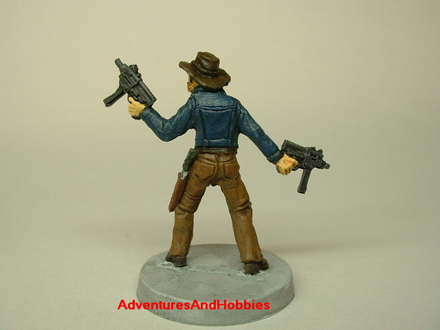 Zombie survivor with sub-machine guns painted figure for role-playing games and table top war games rear view