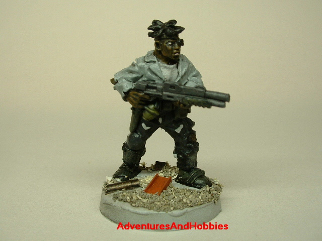 Post apocalypse zombie survivor male civilian warrior painted figure for role-playing games and table top war games front view.